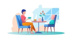 kaksi ihmista keskustelee ystavallisesti poydan aaressa